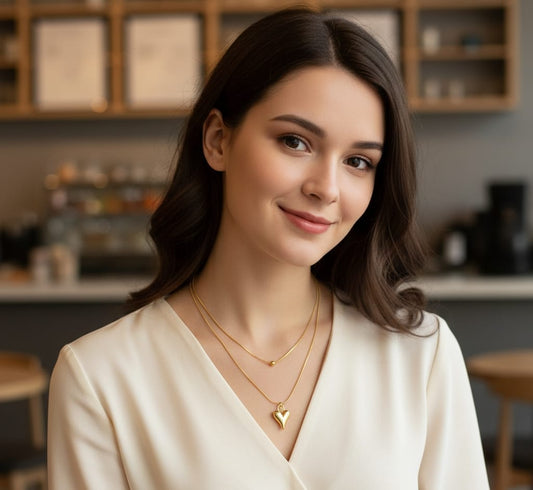 Double-layered gold  chain necklace featuring a single bead and a polished, volumetric heart pendant (HJ72)