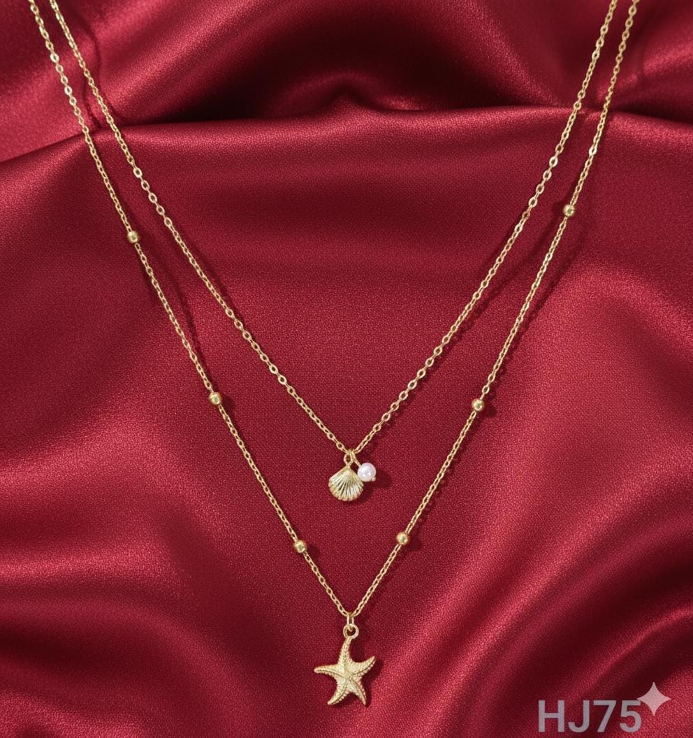 Gold double-layered necklace with satellite chain, featuring a seashell/pearl drop and a textured starfish pendant HJ75